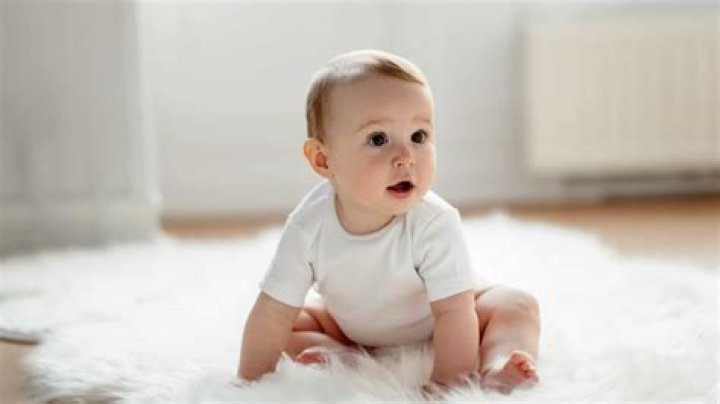 How old do babies have to be to sit on their own?